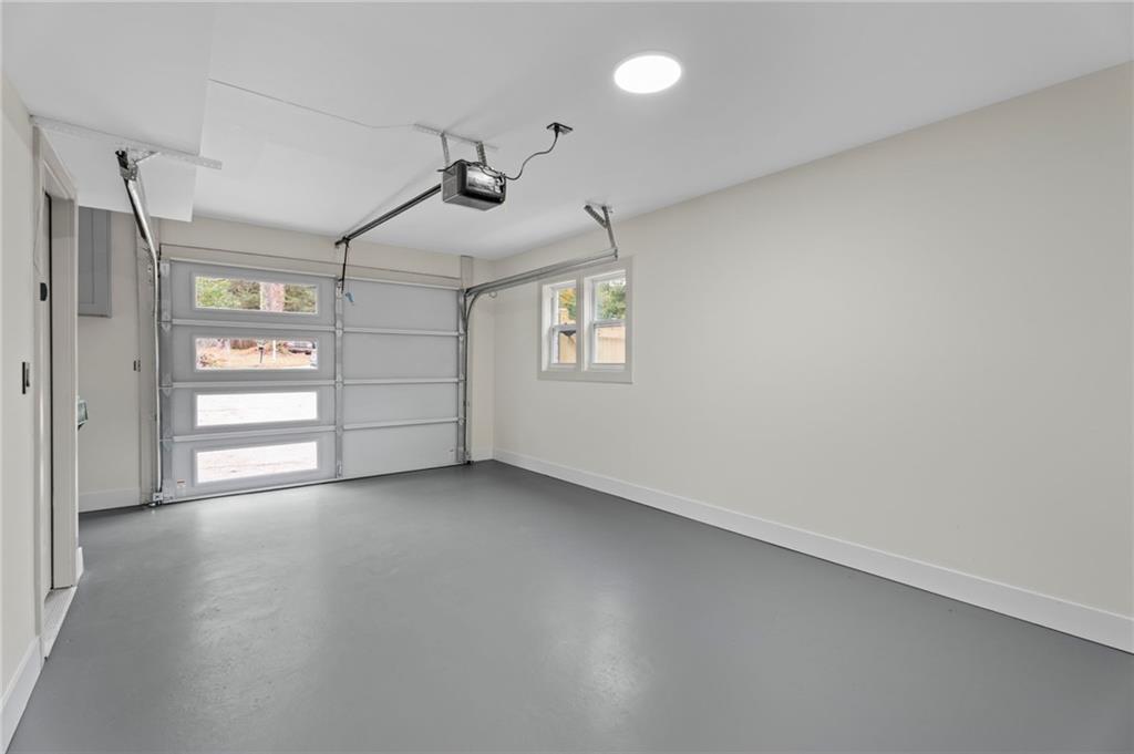 3991 Lindsey Drive Decatur, GA 30035 - Photo 24 of 29 an empty room with windows and cabinet