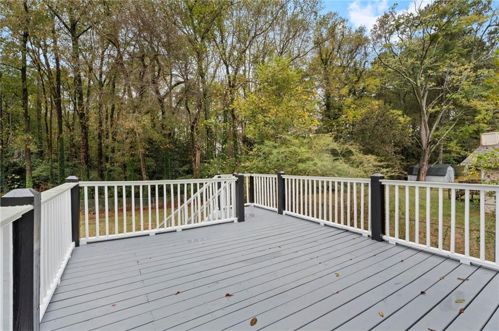 3991 Lindsey Drive Decatur, GA 30035 - Photo 26 of 29 a balcony with wooden floor and fence