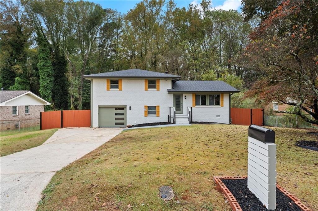 3991 Lindsey Drive Decatur, GA 30035 - Photo 3 of 29 a front view of a house with a yard