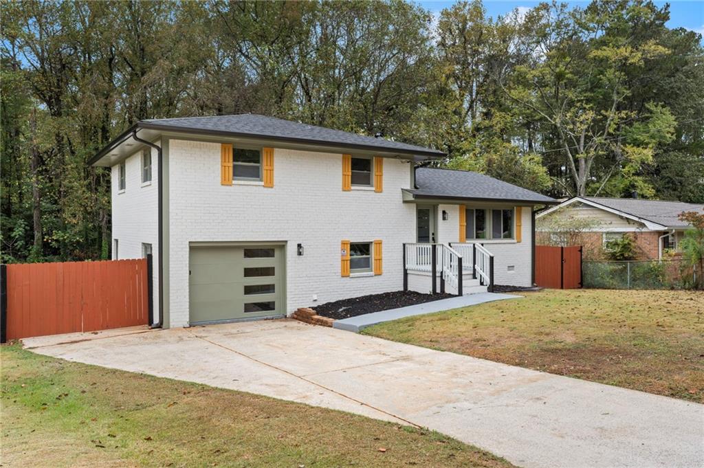 3991 Lindsey Drive Decatur, GA 30035 - Photo 4 of 29 a front view of a house with a yard