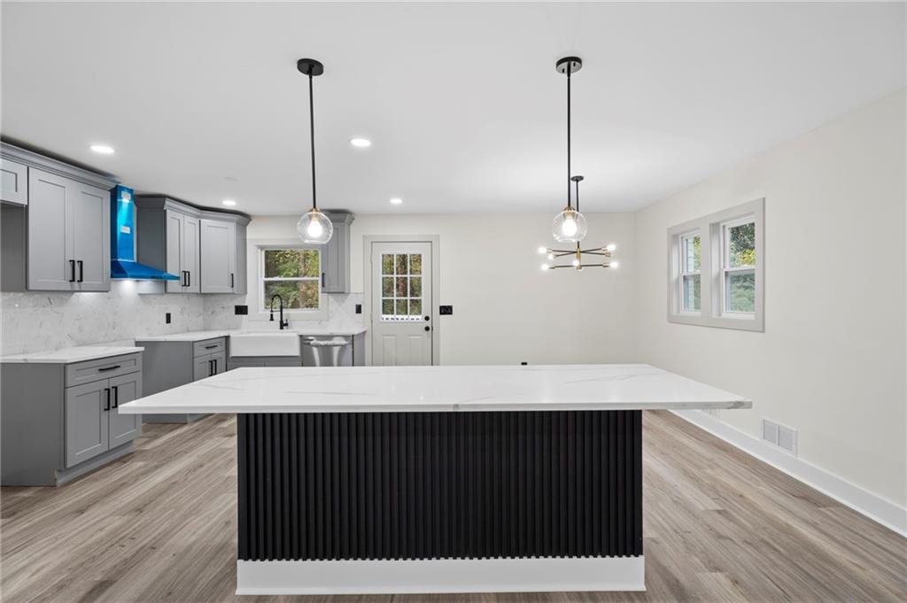 3991 Lindsey Drive Decatur, GA 30035 - Photo 6 of 29 a large kitchen with kitchen island a sink stainless steel appliances and cabinets