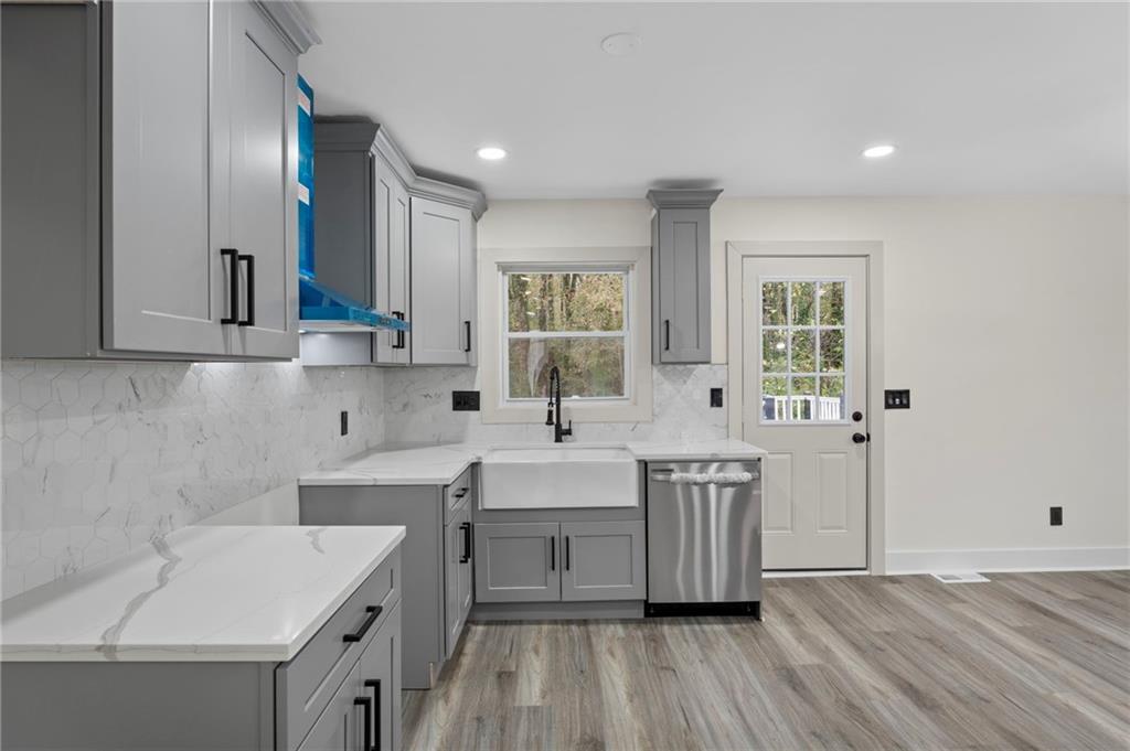 3991 Lindsey Drive Decatur, GA 30035 - Photo 10 of 29 a kitchen with a sink cabinets and wooden floor