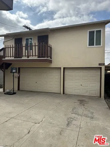 a front view of a house with garage