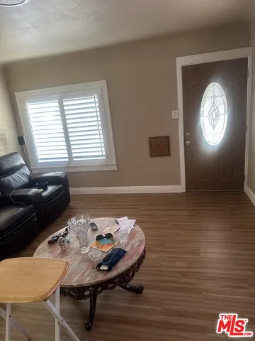 a balcony with furniture and a window