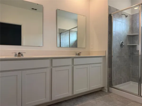 a bathroom with a sink and mirror