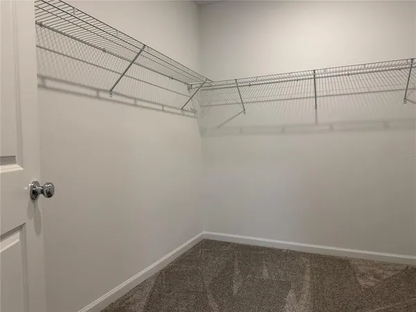 a view of a room with racks on the wall