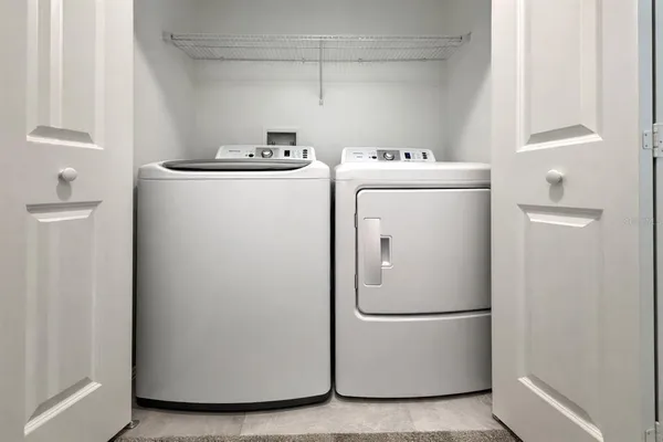 a utility room with dryer and washer