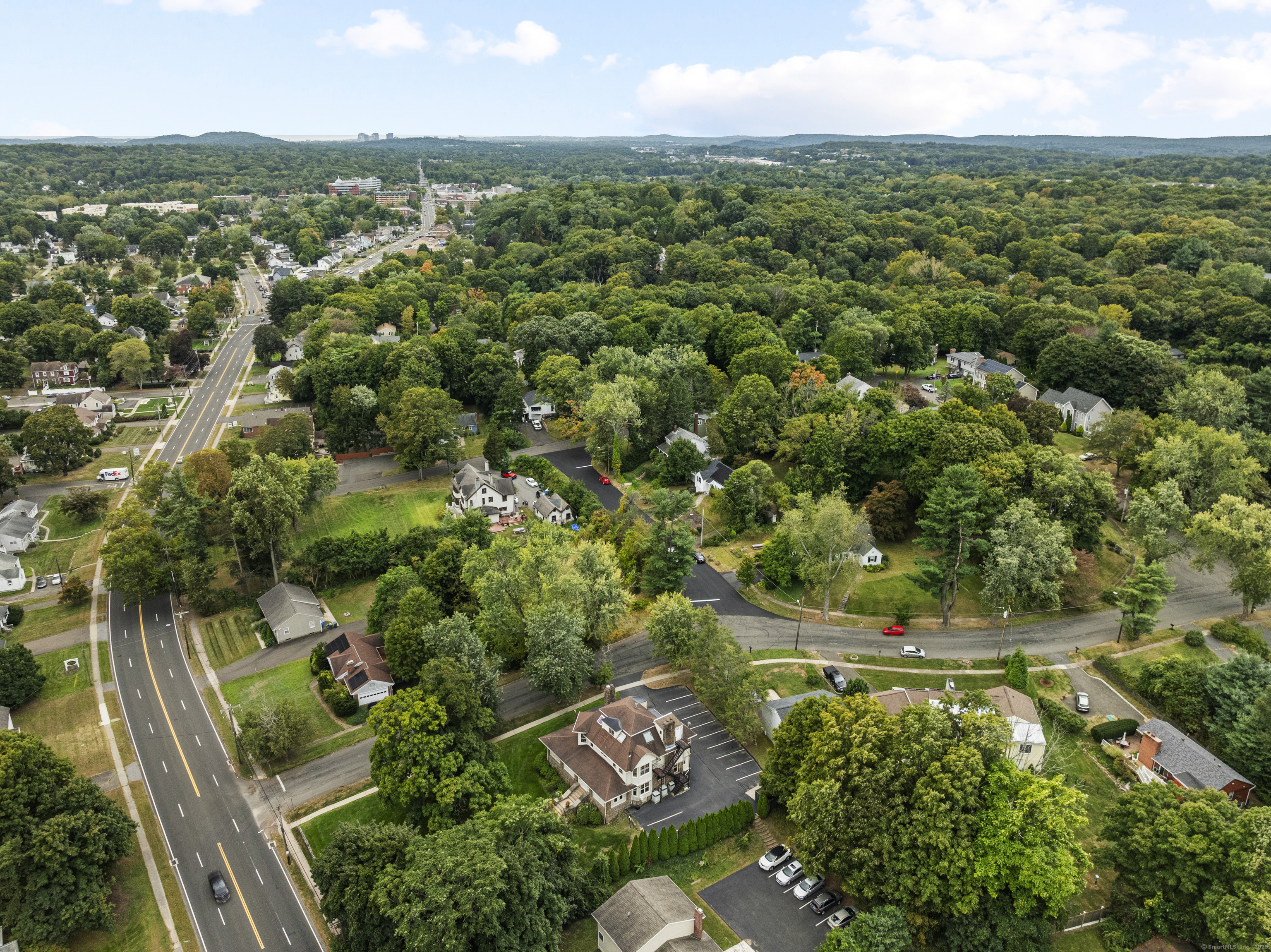2750 Whitney Avenue Hamden, CT 06518 - Photo 13 of 13 an aerial view of residential houses with outdoor space and trees