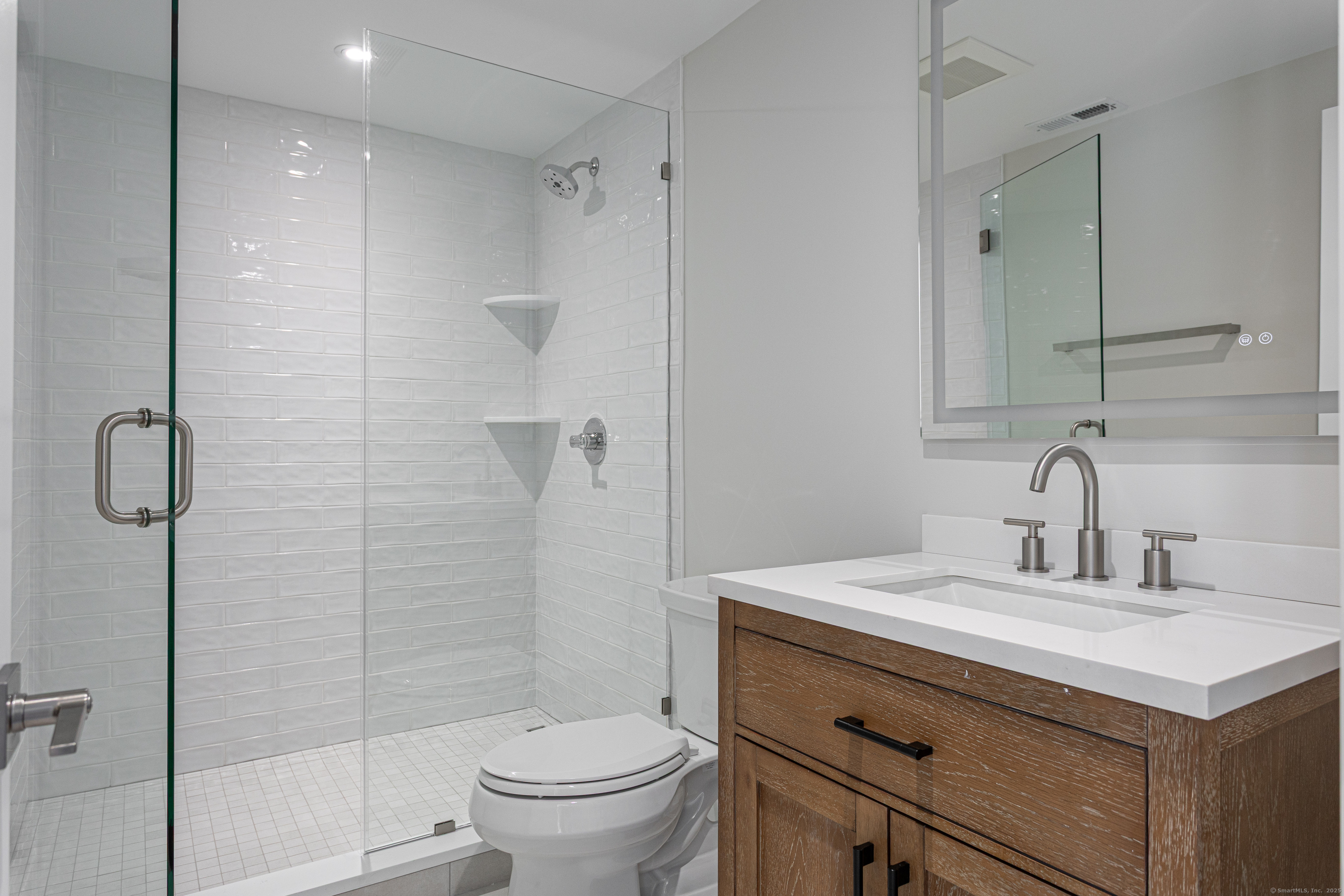 2750 Whitney Avenue Hamden, CT 06518 - Photo 6 of 13 a bathroom with a sink toilet and shower