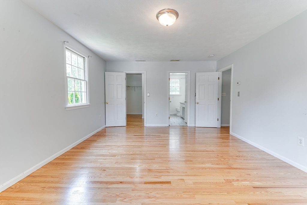 25 Burlington Road Billerica, MA 01821 - Photo 11 of 35 a view of an empty room with window and wooden floor
