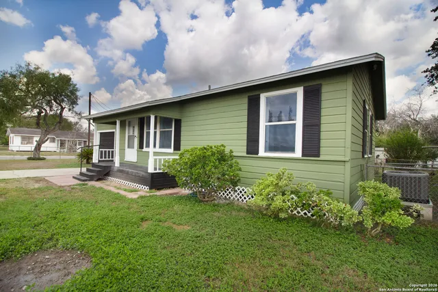 a house view with a garden space