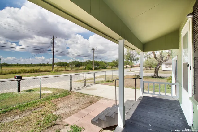 a view of swimming pool with a patio