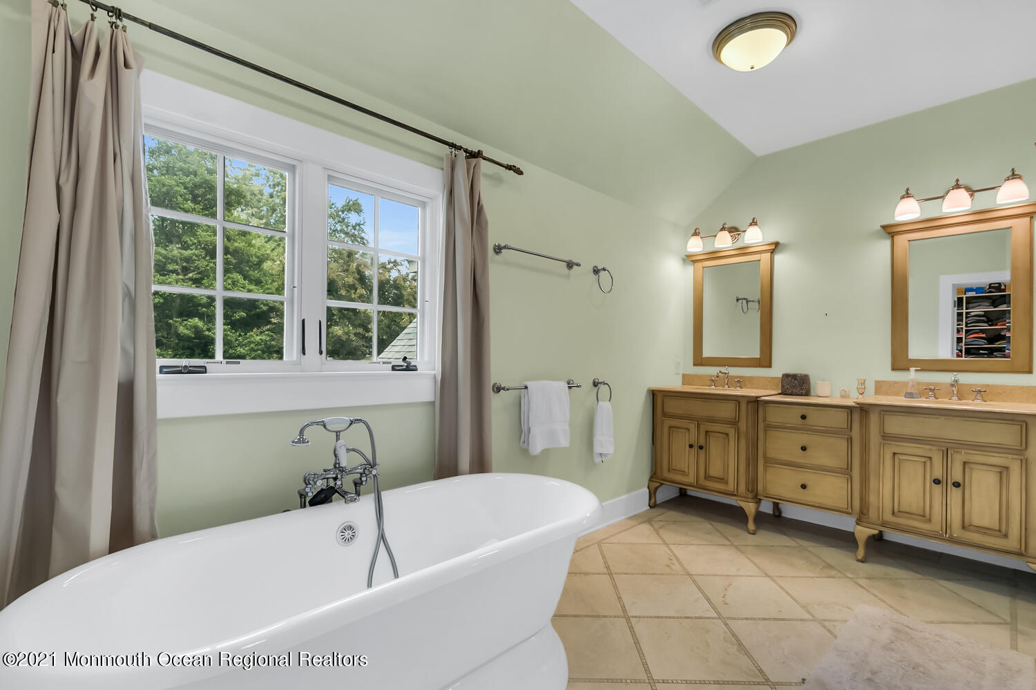162 Black Point Road Rumson, NJ 07760 - Photo 29 of 58 a bathroom with a tub sink and mirror