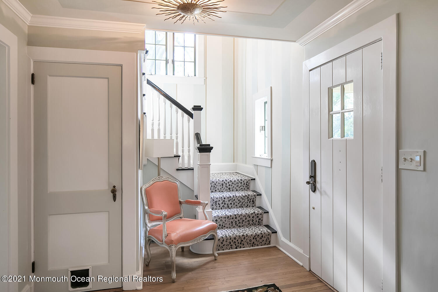 162 Black Point Road Rumson, NJ 07760 - Photo 40 of 58 a hallway with chairs and a window