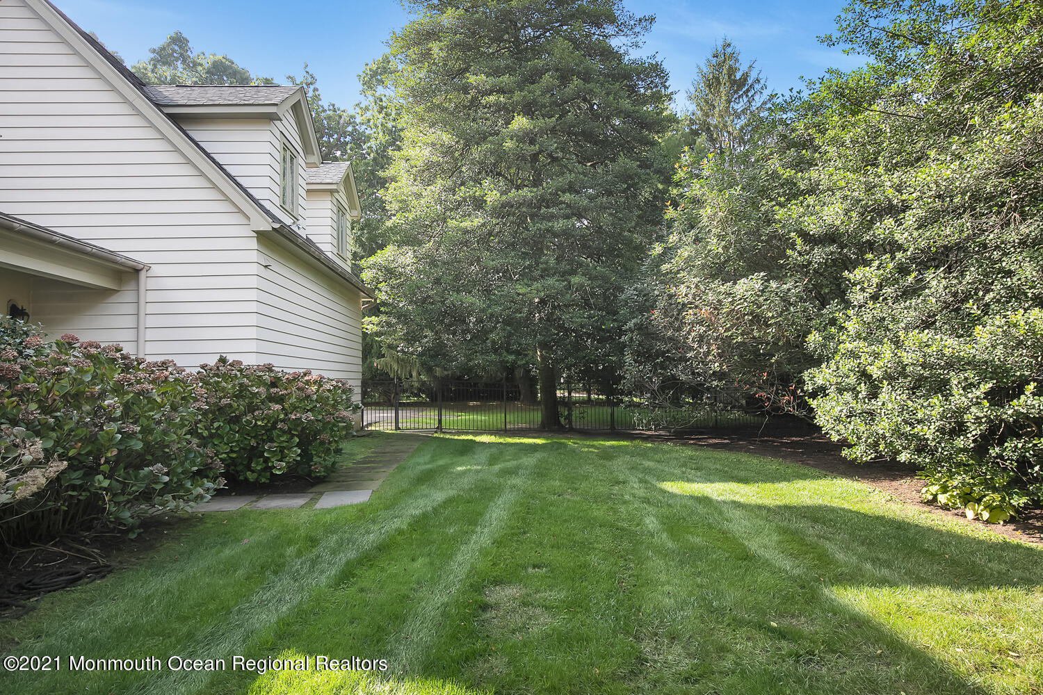 162 Black Point Road Rumson, NJ 07760 - Photo 47 of 58 a view of a backyard with a garden