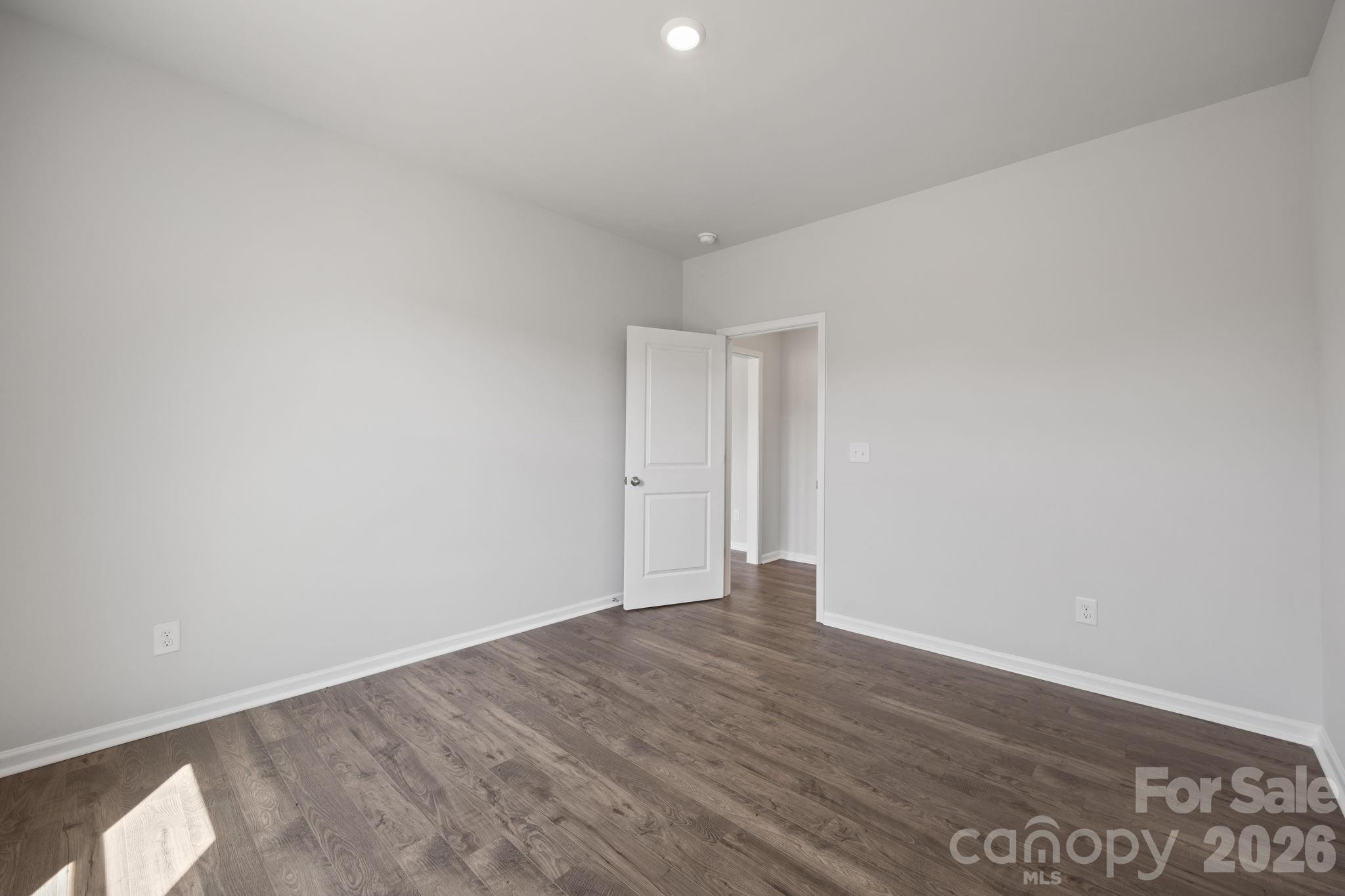 426 Brick House Road York, SC 29745 - Photo 21 of 35 a view of an empty room with wooden floor