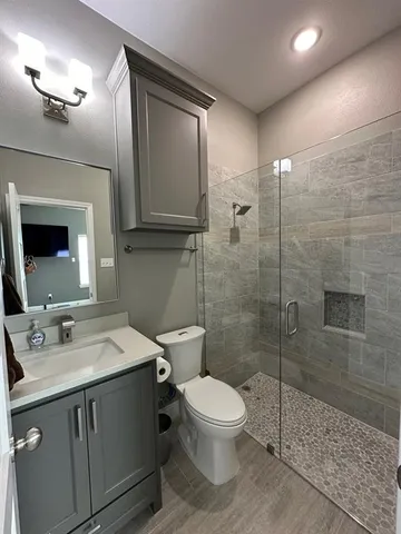 a bathroom with a double vanity sink a and a shower