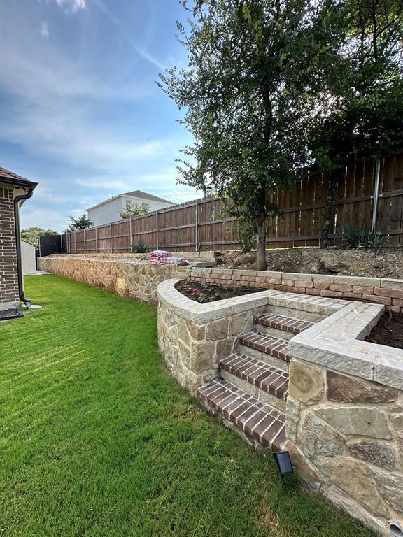 8912 Holt Street Lakeside, TX 76135 - Photo 30 of 39 a view of a backyard with sitting area