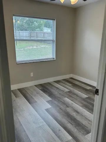 a view of wooden floor and window