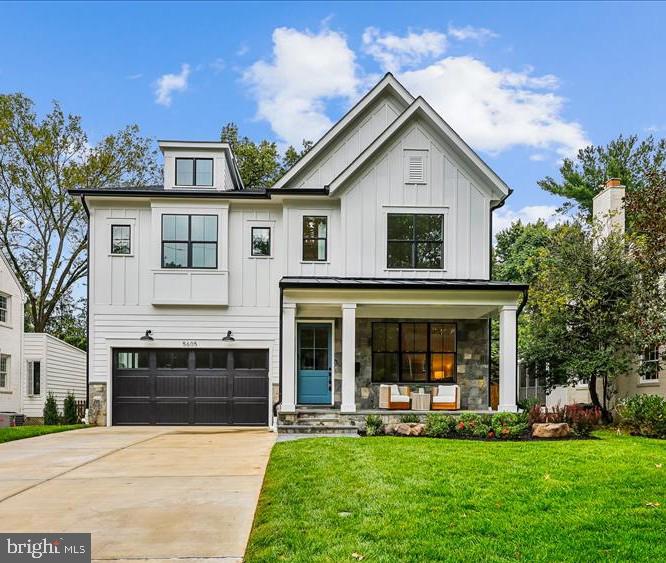 5605 Glenwood Road Bethesda, MD 20817 - Photo 1 of 57 a front view of a house with a yard