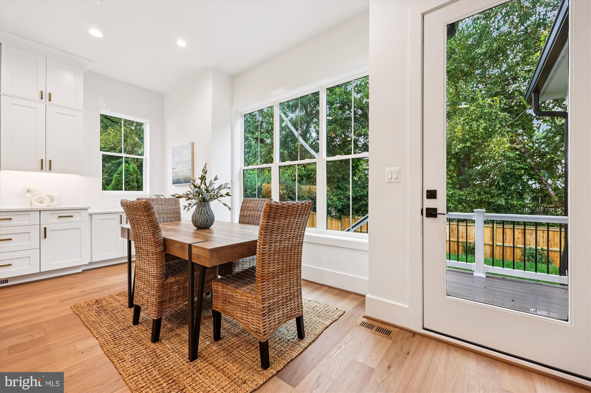 5605 Glenwood Road Bethesda, MD 20817 - Photo 16 of 57 a view of a dining room with furniture window and wooden floor