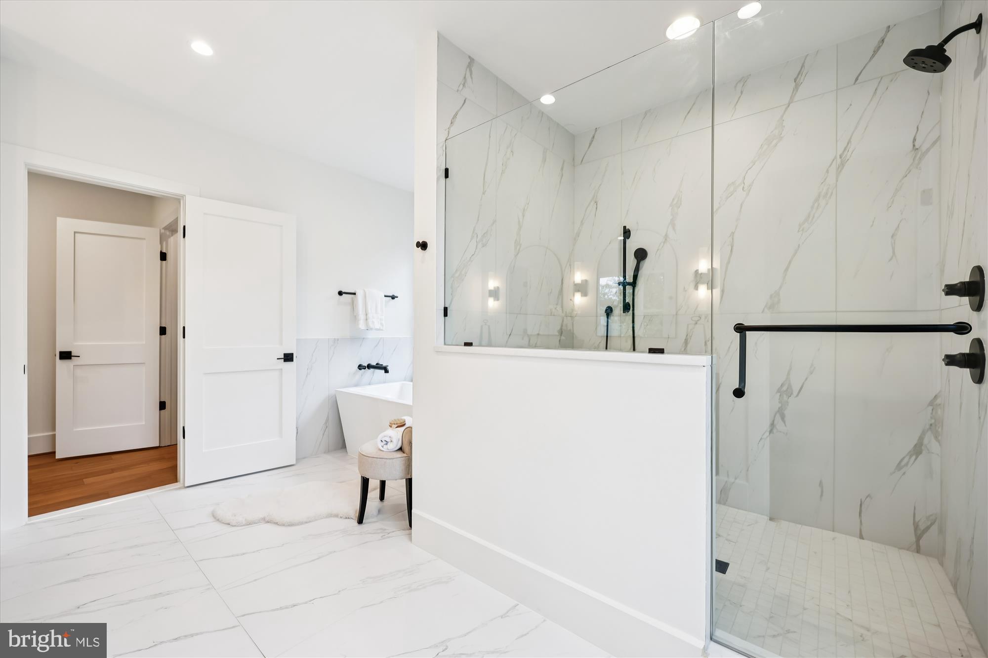 5605 Glenwood Road Bethesda, MD 20817 - Photo 31 of 57 a bathroom with a bathtub and a shower