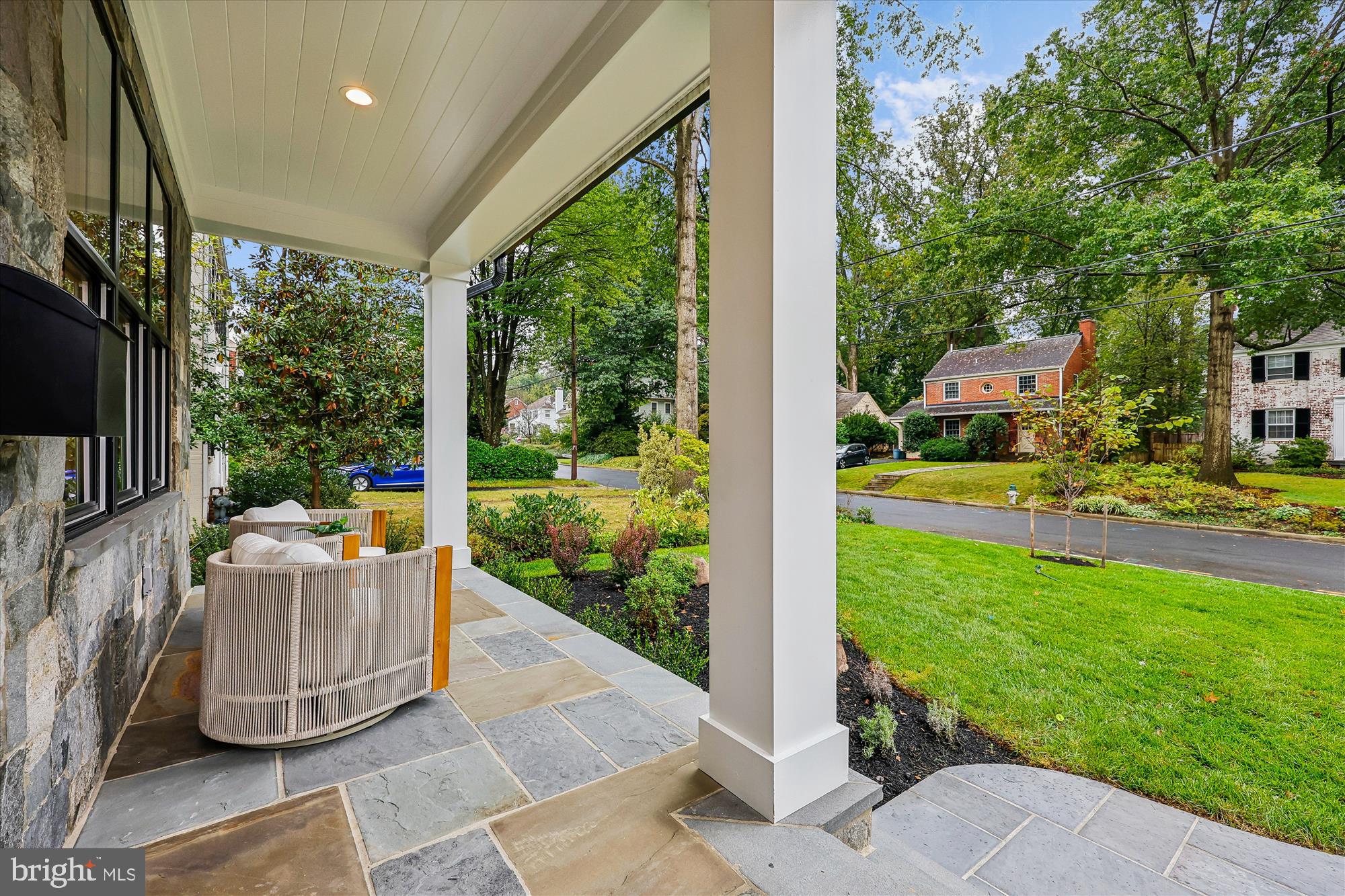 5605 Glenwood Road Bethesda, MD 20817 - Photo 4 of 57 a view of a patio with couches plants and large tree