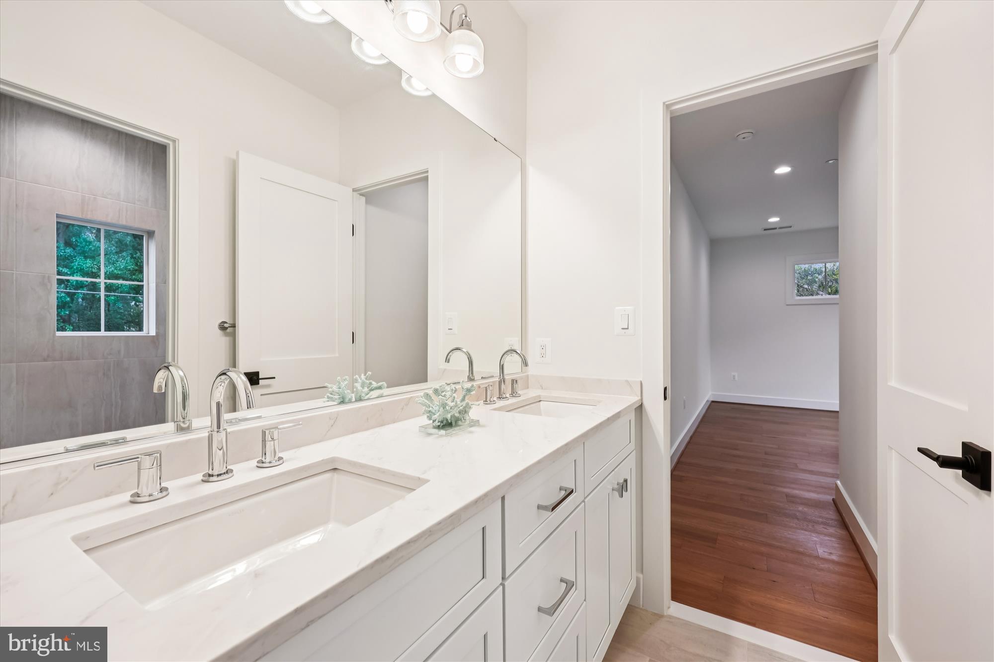 5605 Glenwood Road Bethesda, MD 20817 - Photo 42 of 57 a bathroom with a sink vanity granite and a mirror