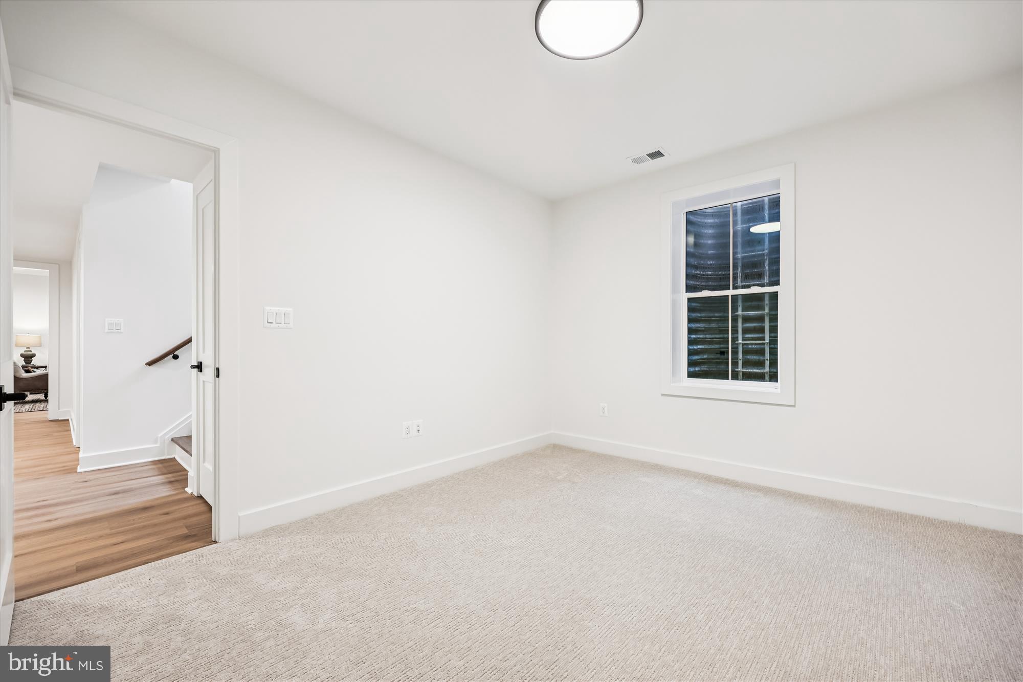 5605 Glenwood Road Bethesda, MD 20817 - Photo 46 of 57 a view of an empty room with a window