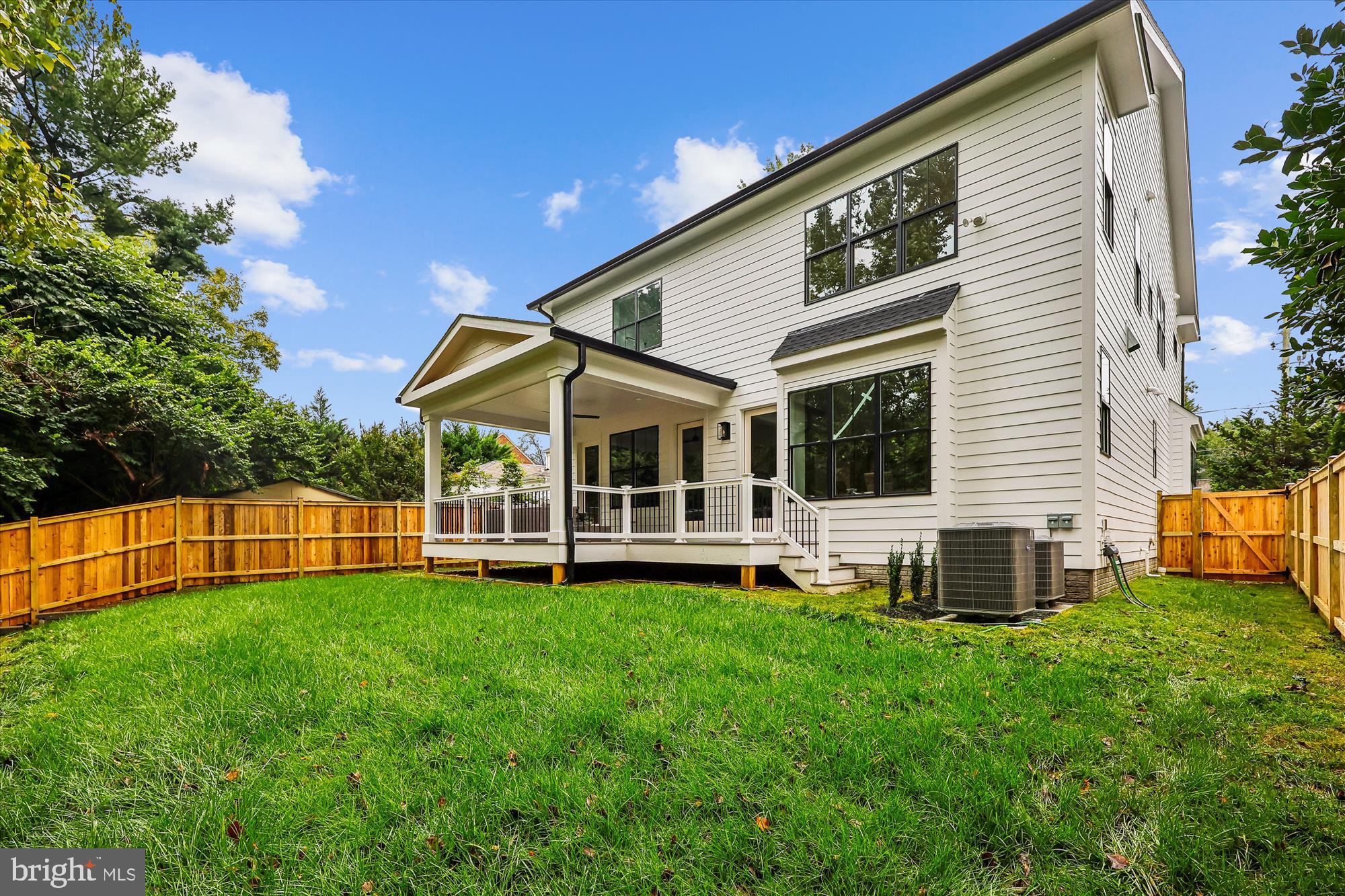 5605 Glenwood Road Bethesda, MD 20817 - Photo 53 of 57 a view of a house with a yard and a patio