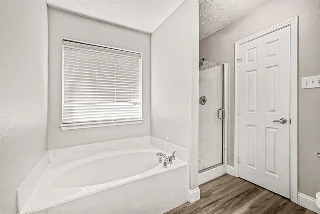 a white bath tub sitting next to a window