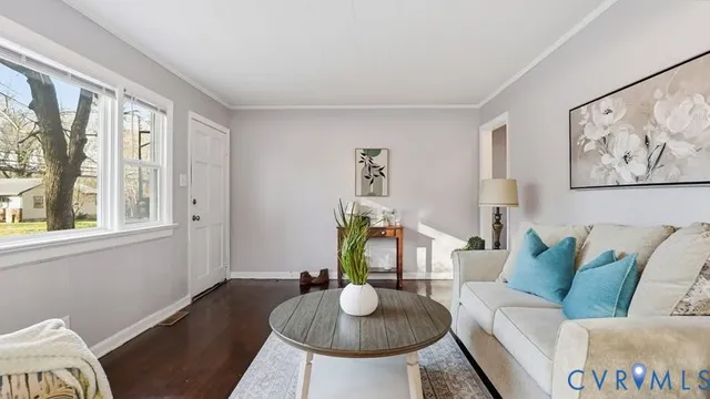 a living room with furniture and a table