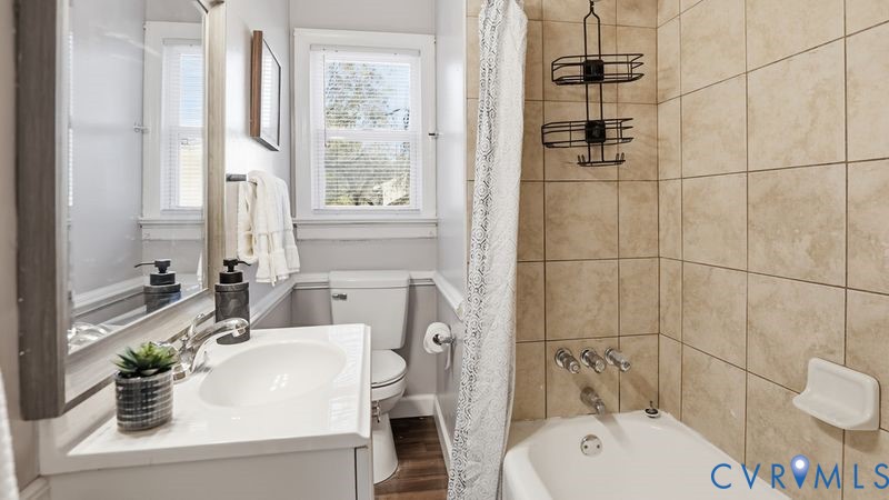2313 Ruffin Road Richmond, VA 23234 - Photo 8 of 40 a bathroom with a sink a toilet and shower