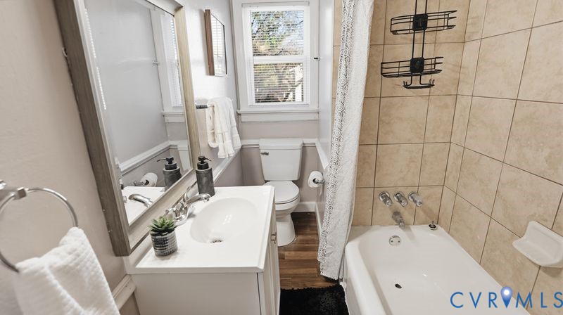 2313 Ruffin Road Richmond, VA 23234 - Photo 9 of 40 a bathroom with a sink a toilet and shower