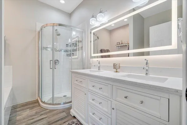 a view of a house with a big yard and large trees