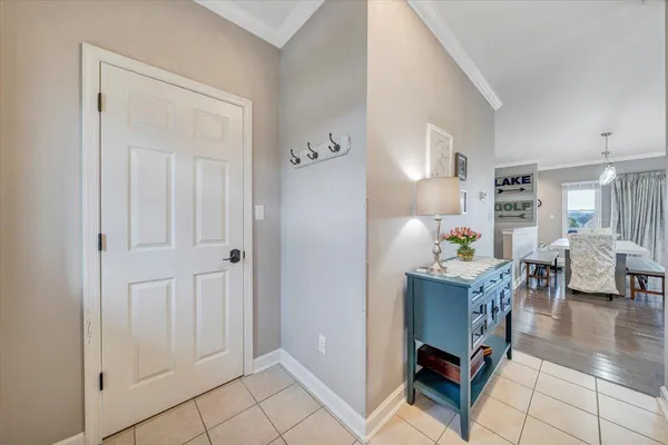 a kitchen with stainless steel appliances granite countertop a sink a refrigerator and a granite counter tops