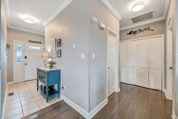 a kitchen with granite countertop a sink a counter top space and living room view
