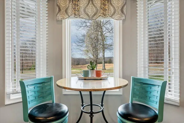 a spacious bathroom with a sink double vanity and a mirror