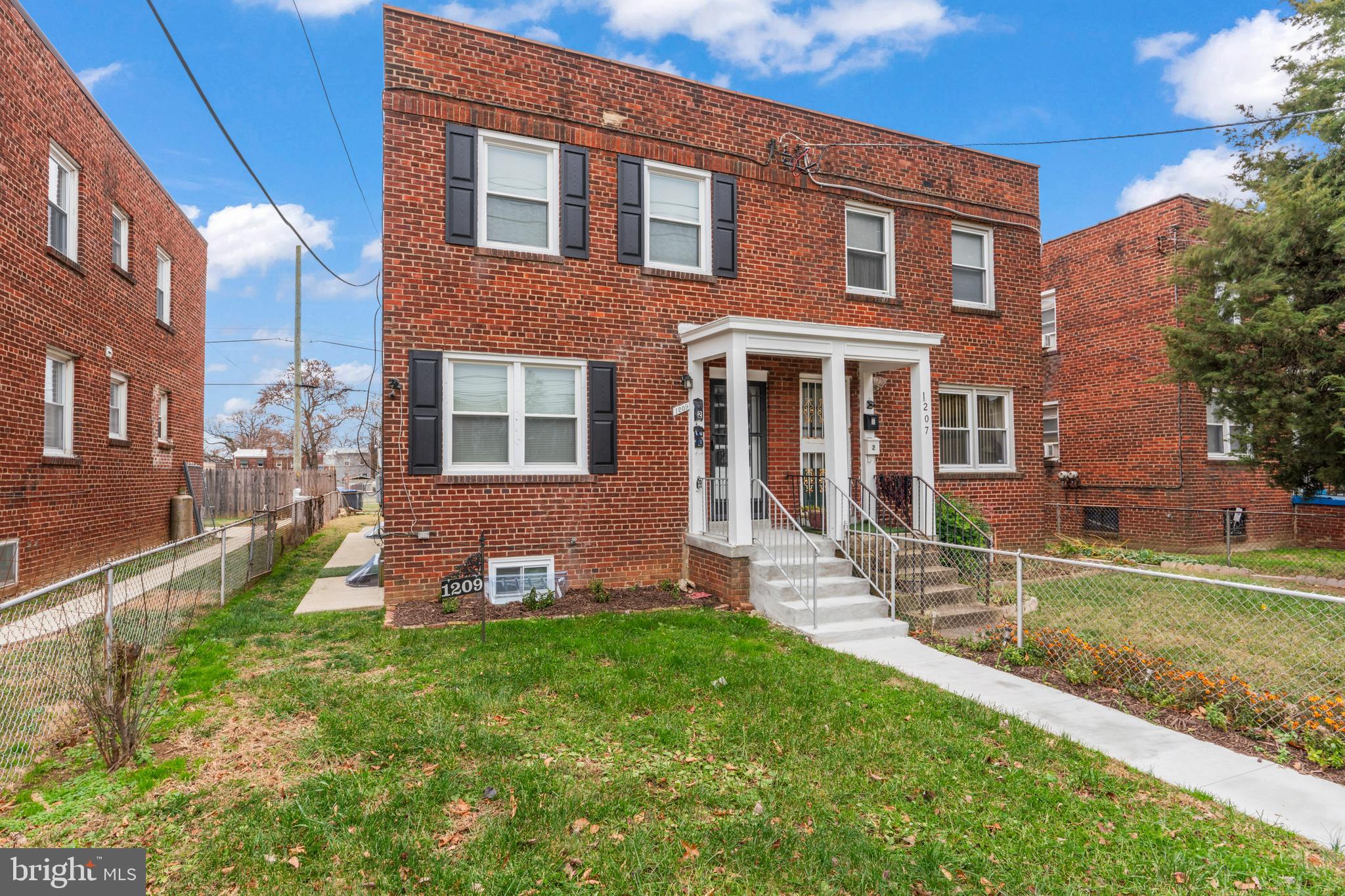1209 Savannah Street Southeast Washington, DC 20032 - Photo 1 of 27 a view of a house with a yard