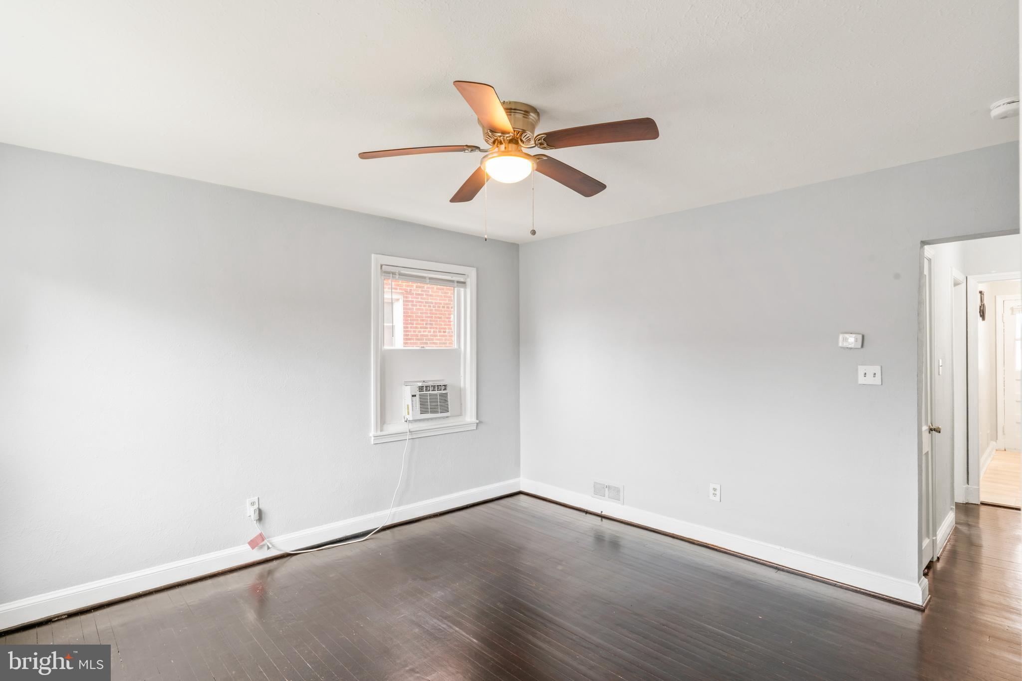 1209 Savannah Street Southeast Washington, DC 20032 - Photo 11 of 27 a view of empty room with wooden floor and fan