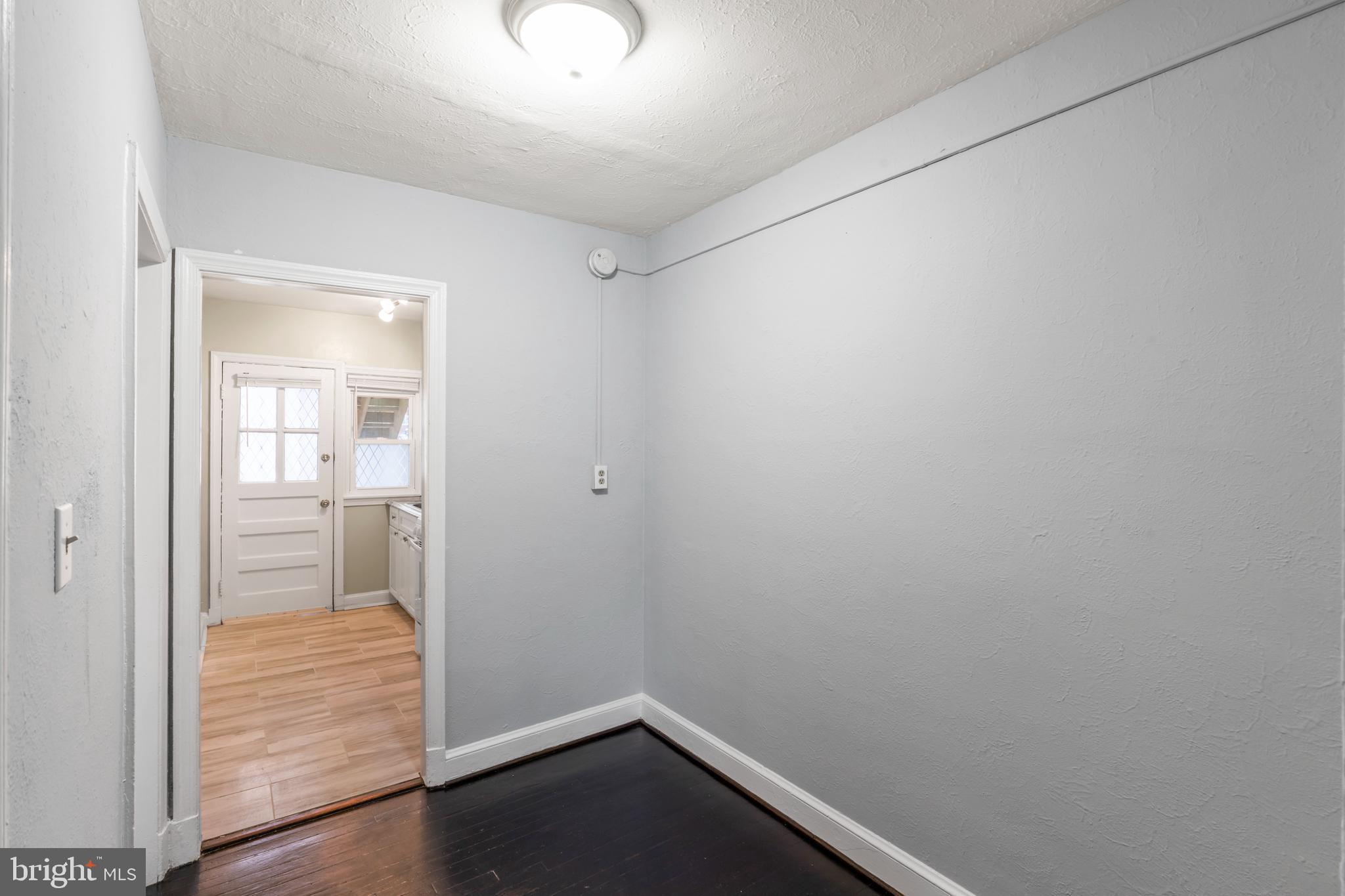 1209 Savannah Street Southeast Washington, DC 20032 - Photo 13 of 27 wooden floor in an empty room