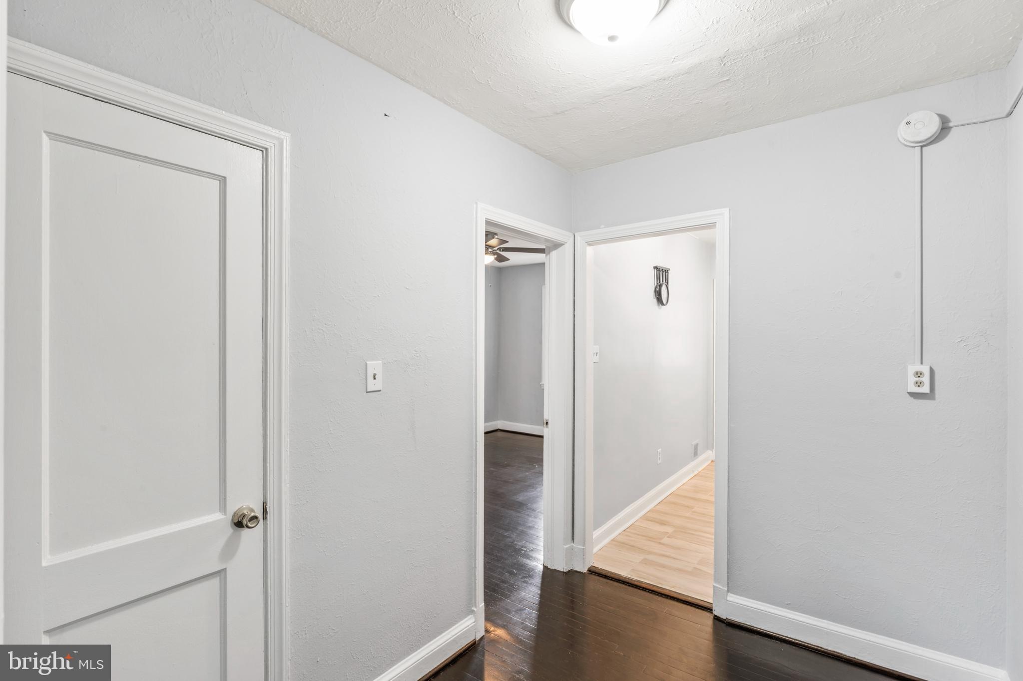 1209 Savannah Street Southeast Washington, DC 20032 - Photo 15 of 27 a view of a hallway with closet and wooden floor