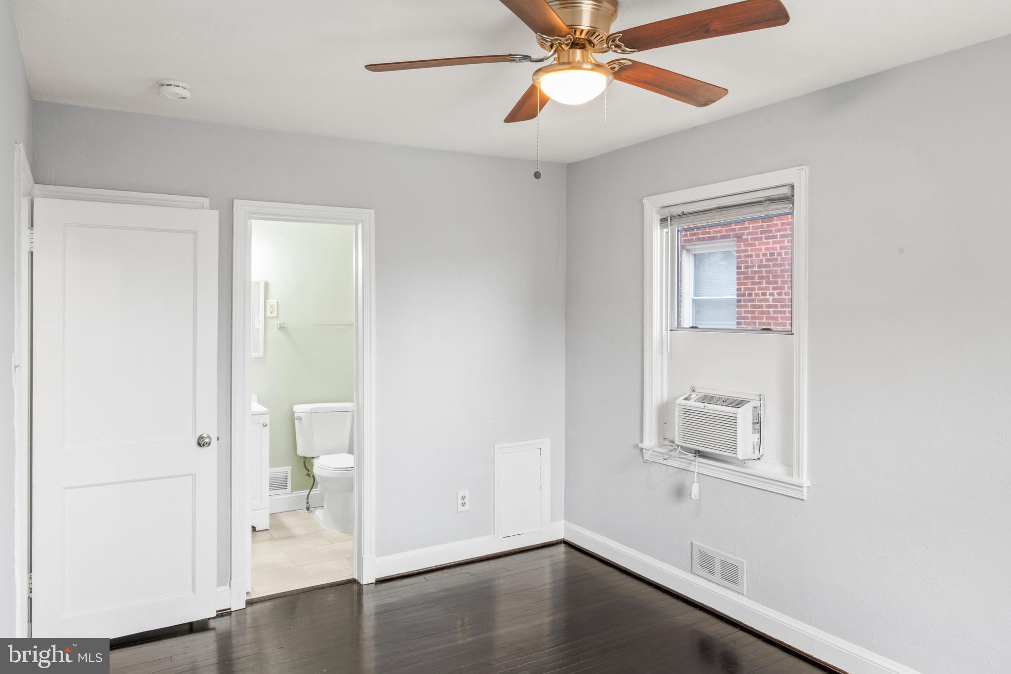 1209 Savannah Street Southeast Washington, DC 20032 - Photo 18 of 27 a view of empty room with wooden floor and fan