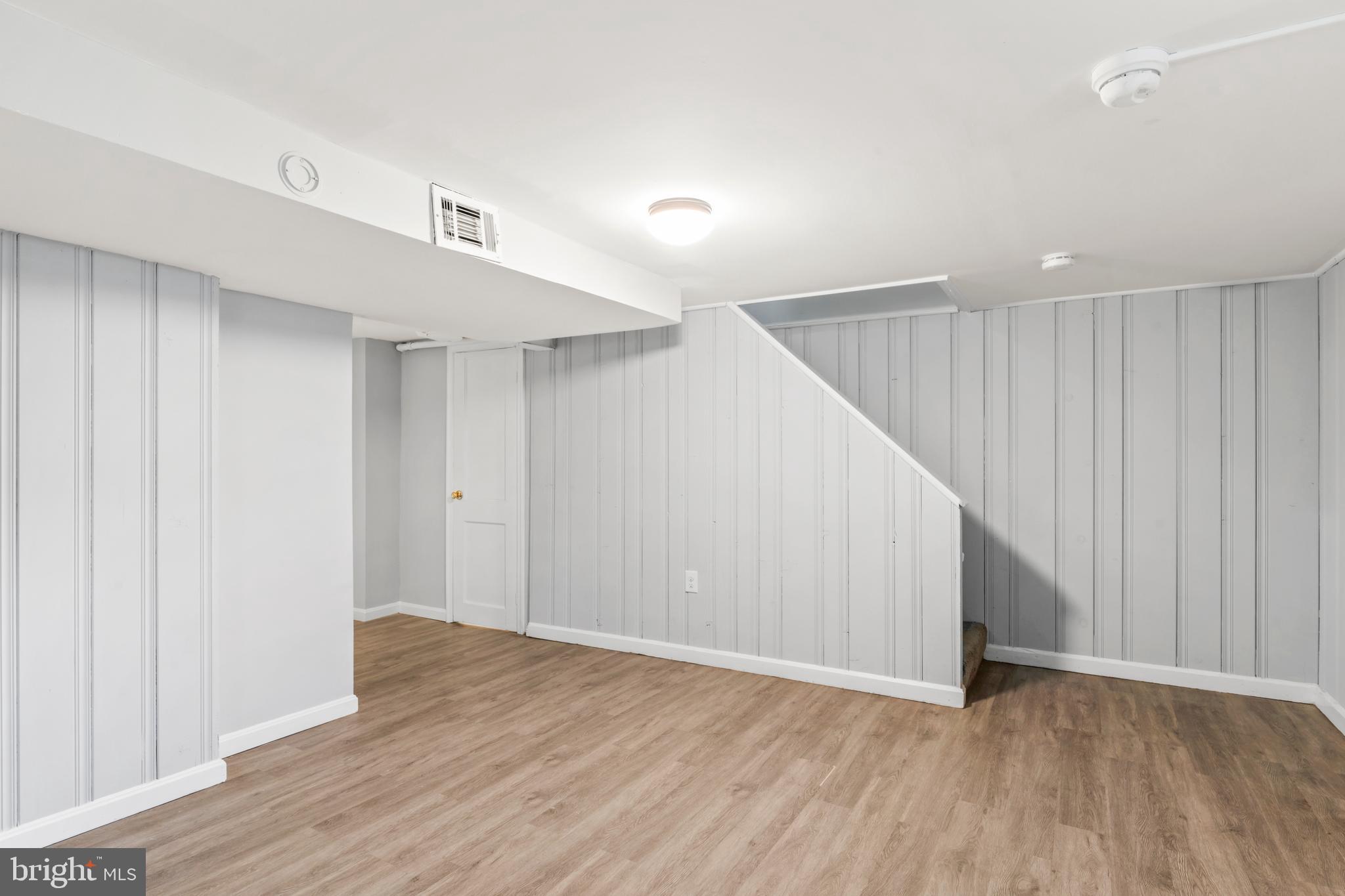 1209 Savannah Street Southeast Washington, DC 20032 - Photo 23 of 27 a view of an empty room with wooden floor