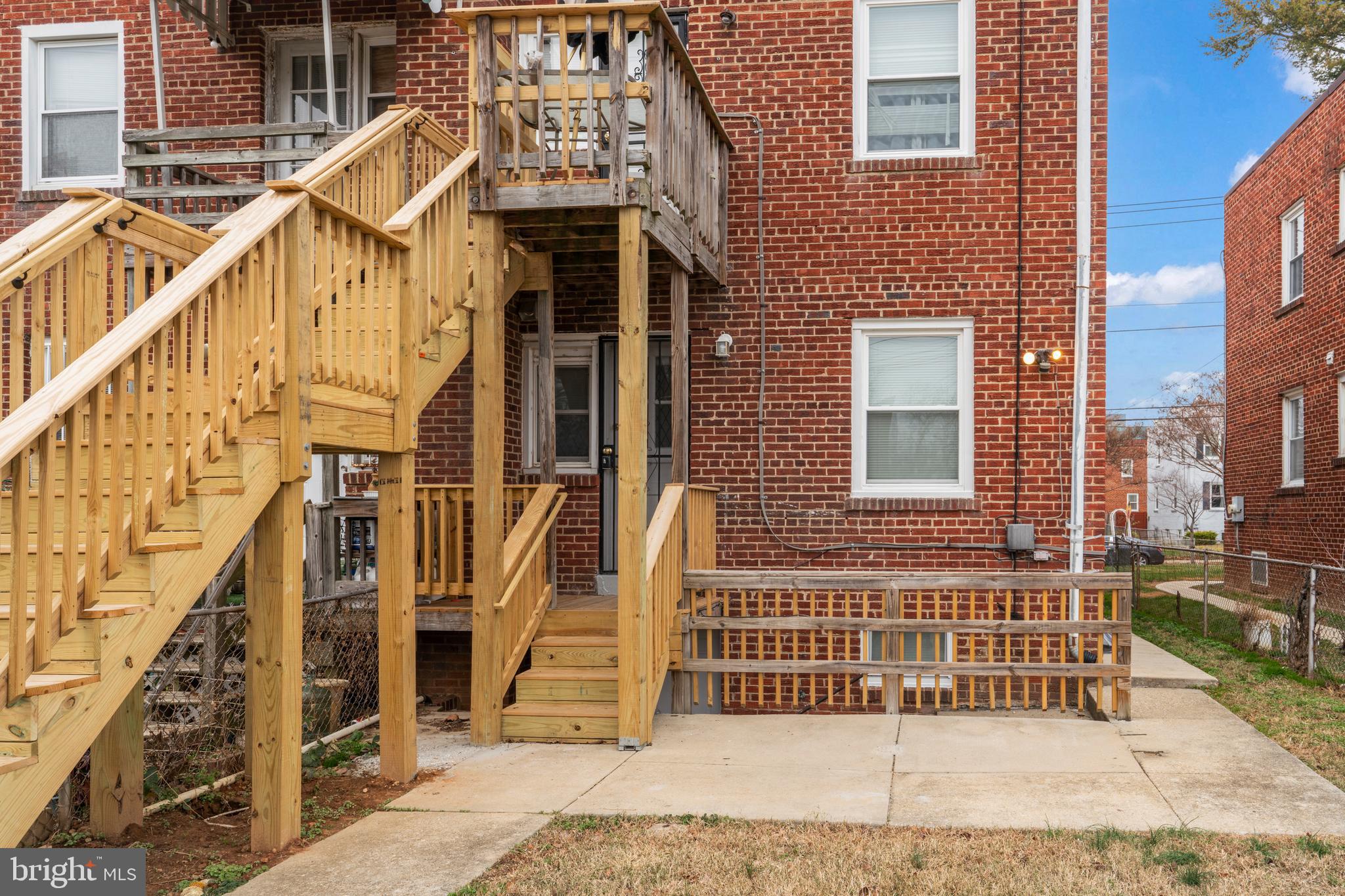 1209 Savannah Street Southeast Washington, DC 20032 - Photo 4 of 27 a front view of a house with a yard