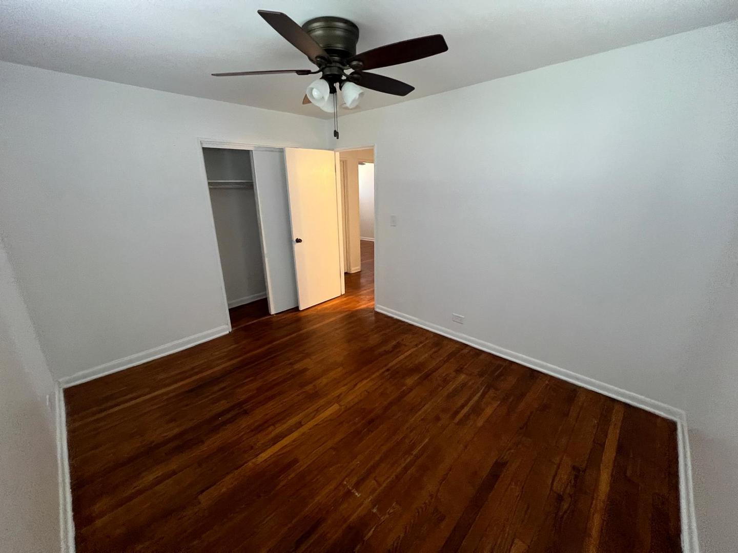 16442 Honore Avenue Markham, IL 60428 - Photo 8 of 16 wooden floor in an empty room