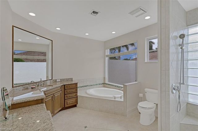a bathroom with a toilet a sink and bathtub