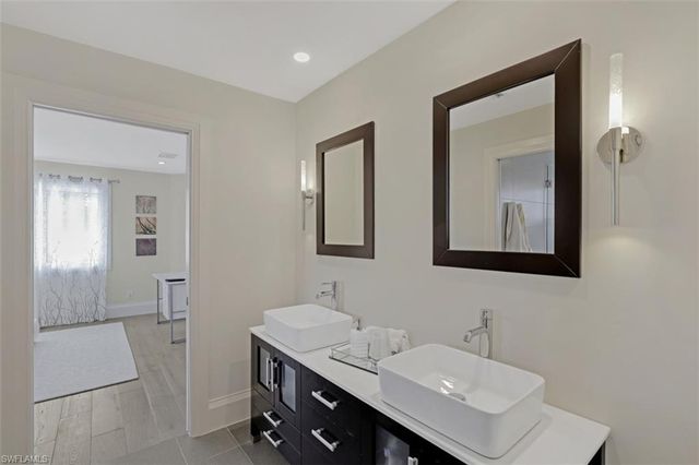 a bathroom with a sink and a mirror