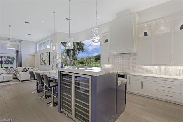 a kitchen with stainless steel appliances granite countertop a stove and a refrigerator