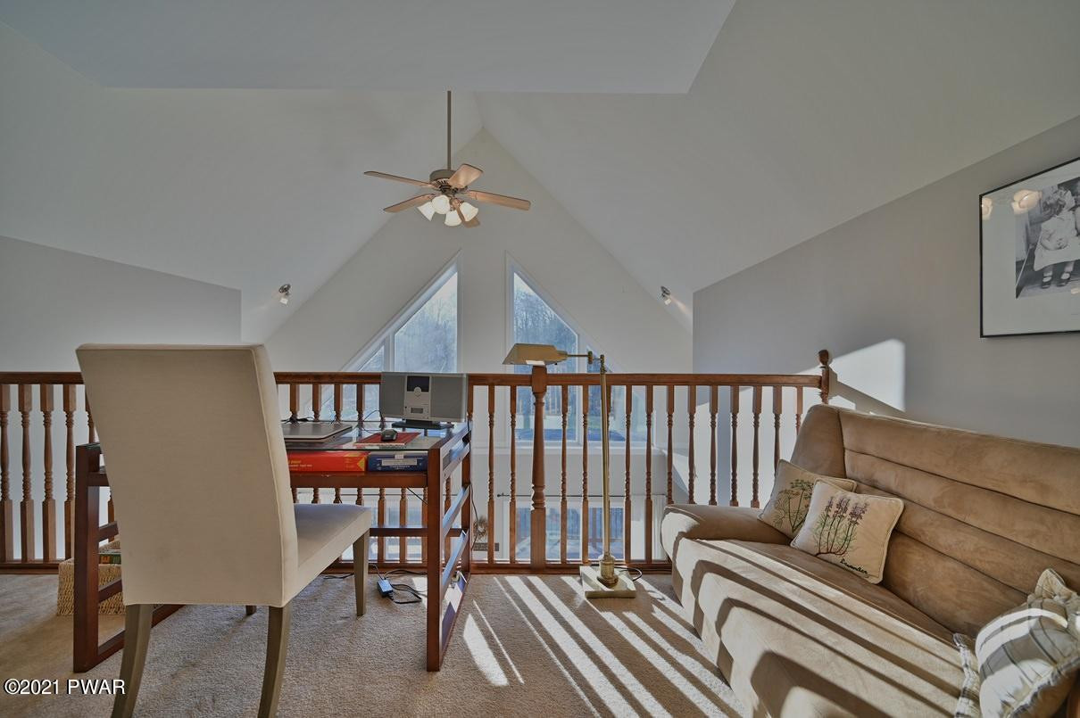 76 Rockway Road Lake Ariel, PA 18436 - Photo 58 of 101 a living room with furniture a ceiling fan and a rug